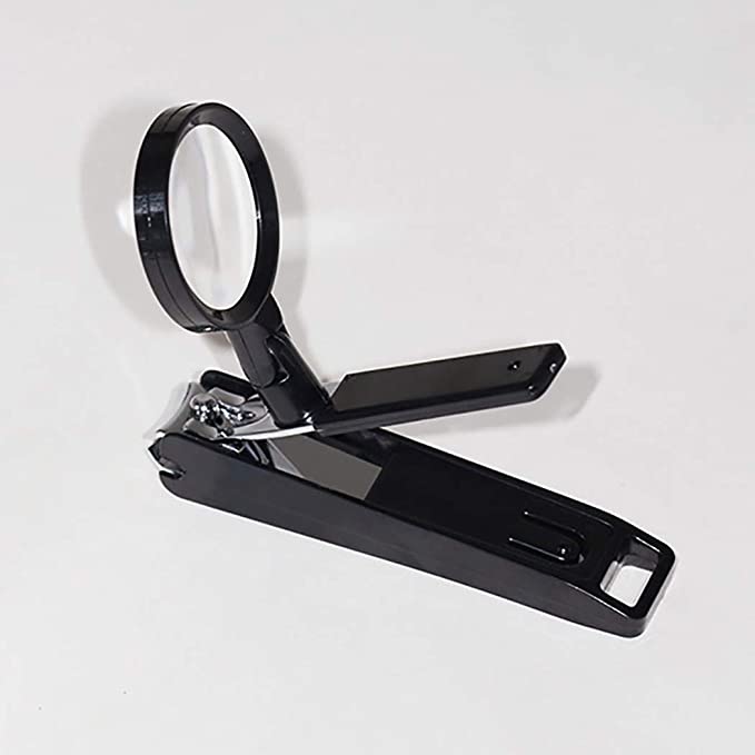 Nail clipper with magnifier